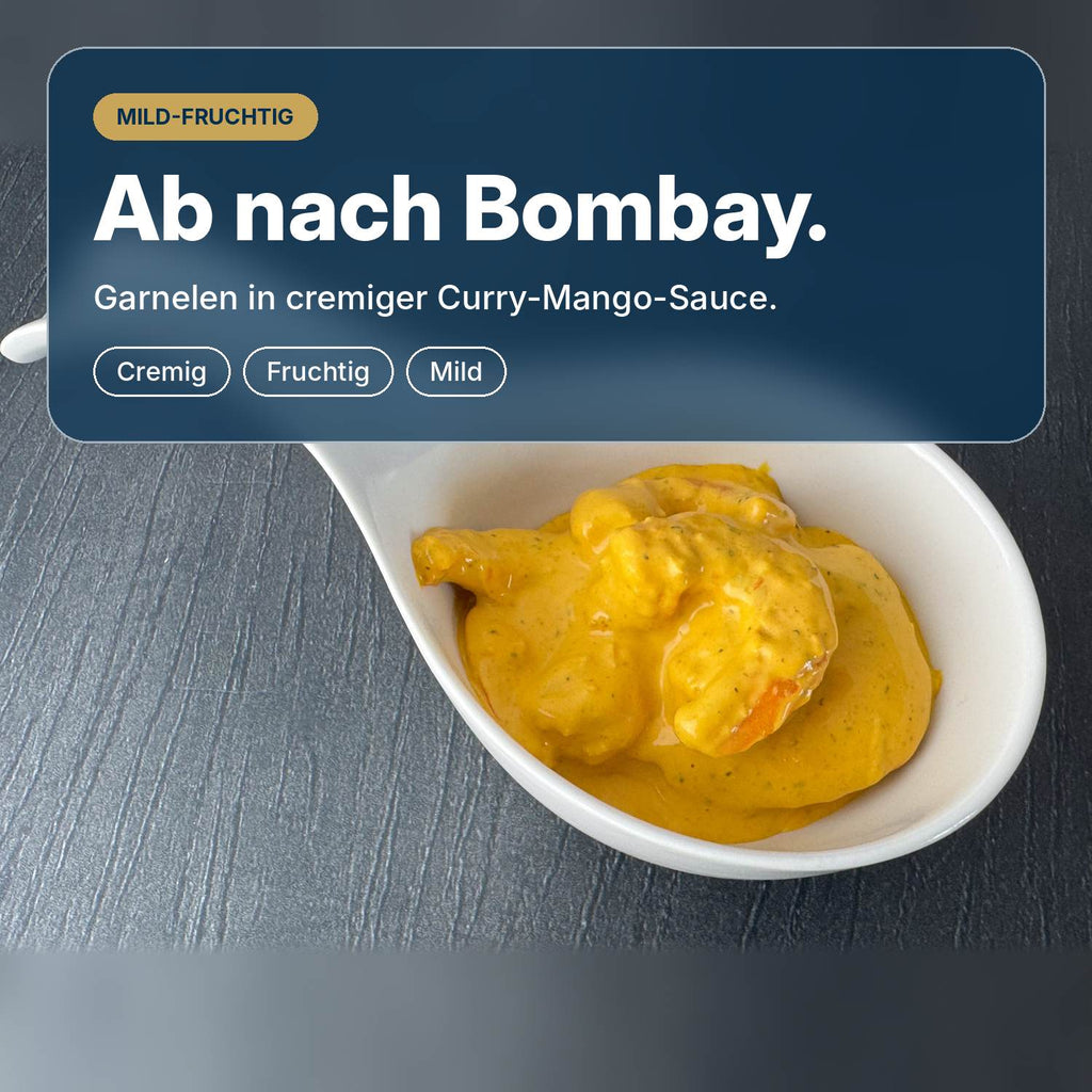 Ab nach Bombay: Garnelensalat mit saftigen Garnelen in cremiger Currysauce mit Mango, Kokos und Mandeln, mild und fruchtig.